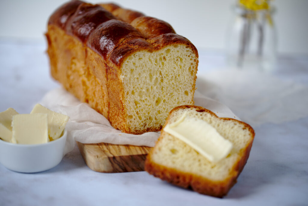 Photo of loaf of brioche with butter