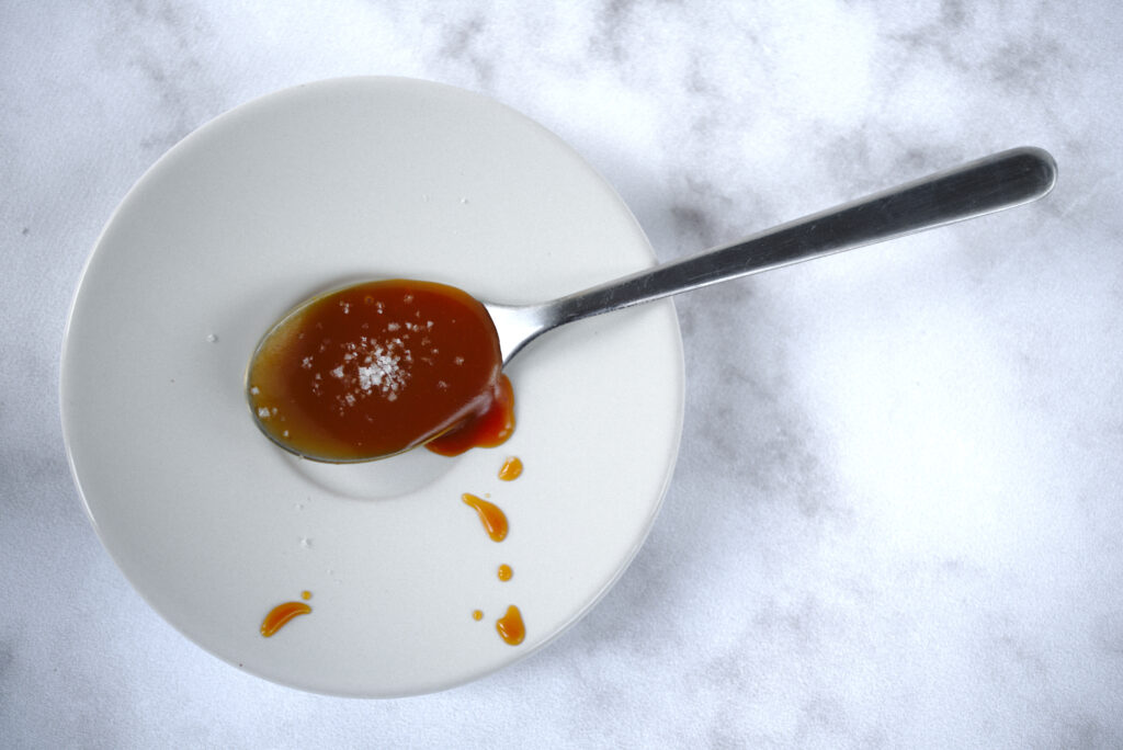 picture of spoonful of salted butter caramel sauce