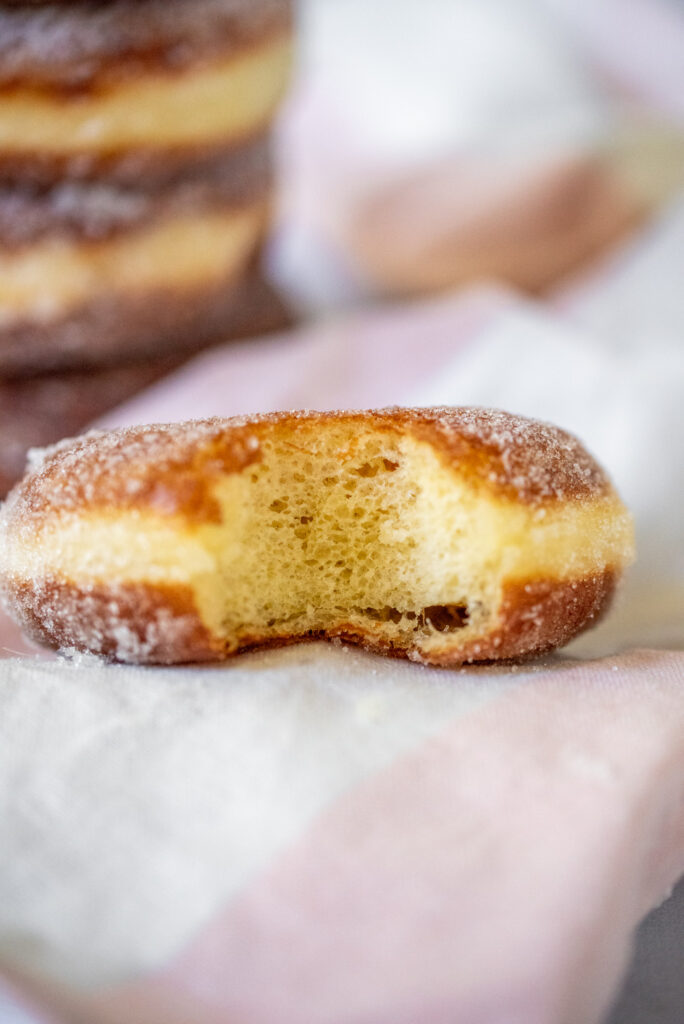 bite picture of sugar tossed doughnuts