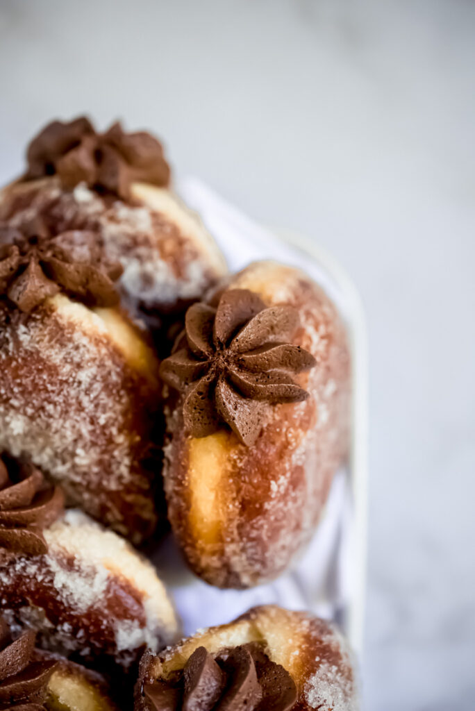 Brioche doughnuts- The perfect marriage of a classic American dessert and French brioche, filled with whipped dark chocolate ganache.