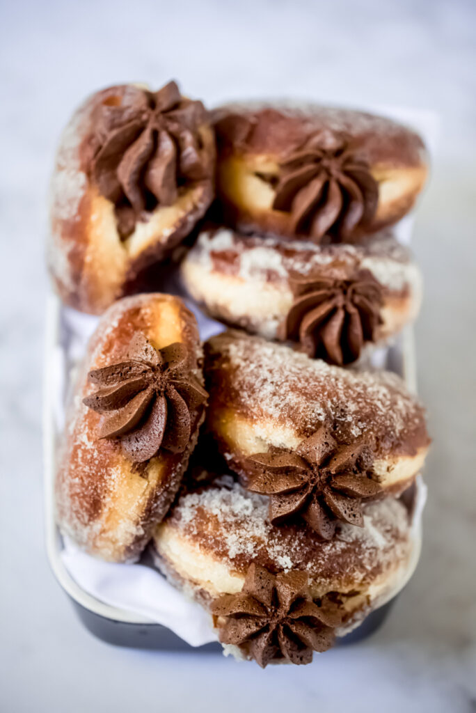 Brioche doughnuts- The perfect marriage of a classic American dessert and French brioche, filled with whipped dark chocolate ganache.